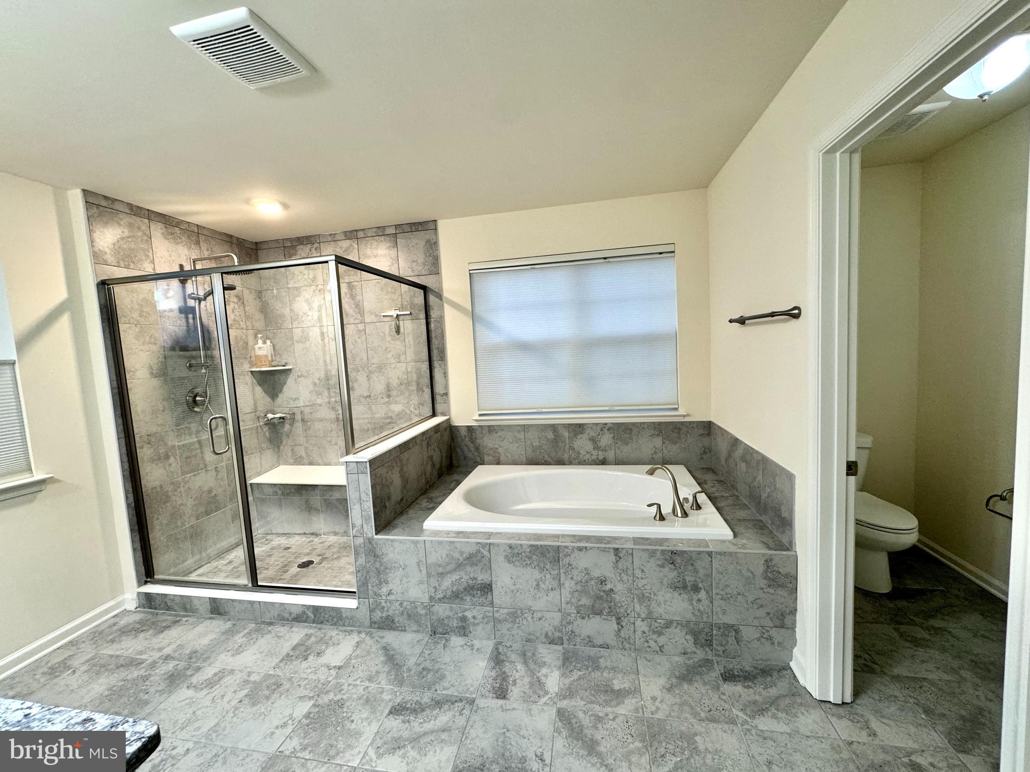 447 Lee Place Exton, PA 19341 - Photo 21 of 31 a bathroom with a tub shower and toilet