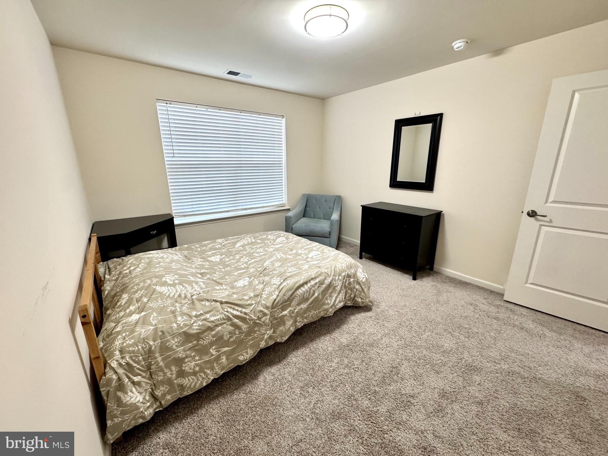 447 Lee Place Exton, PA 19341 - Photo 24 of 31 a bedroom with a bed and a dresser