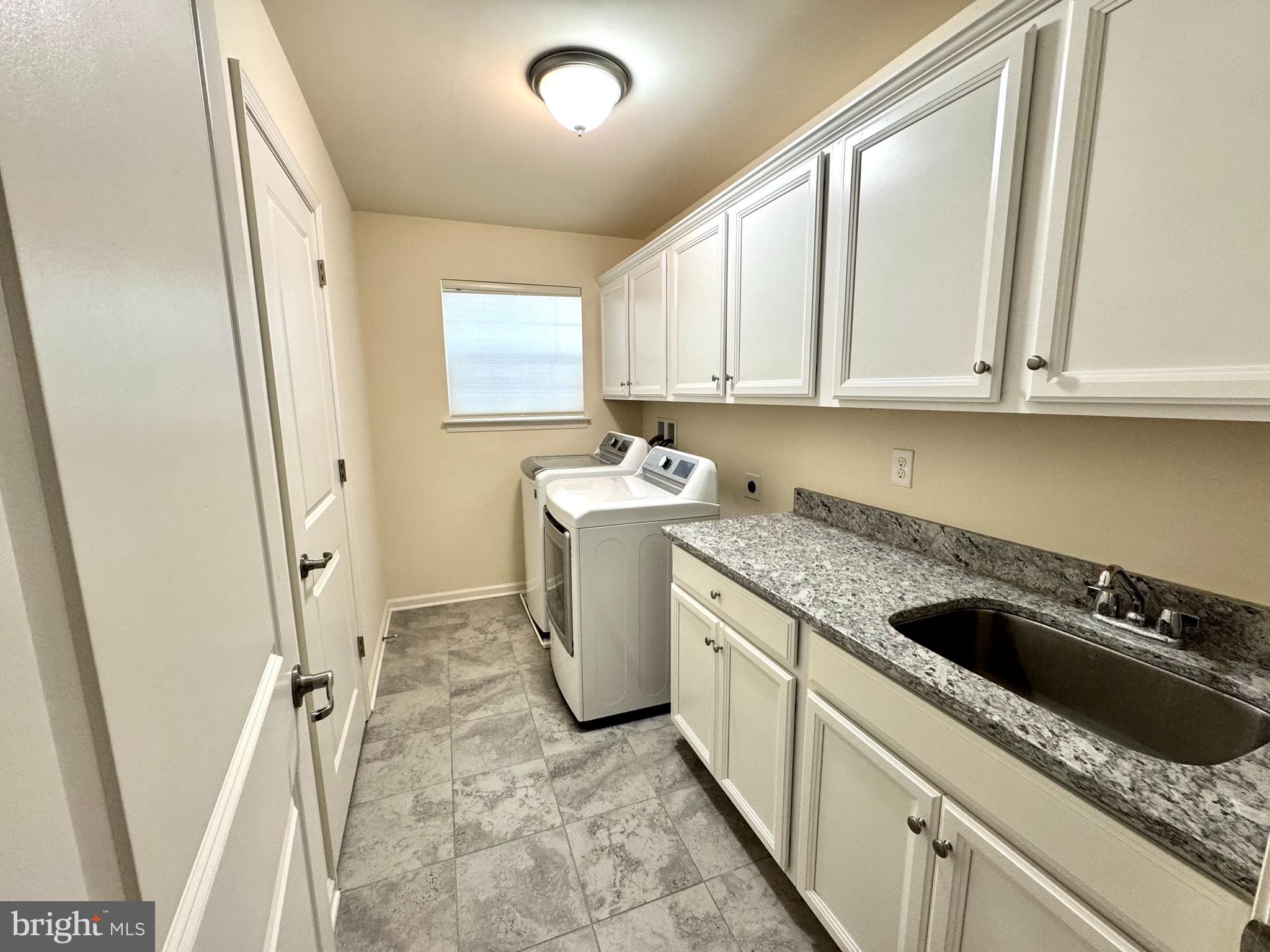 447 Lee Place Exton, PA 19341 - Photo 26 of 31 a kitchen with a sink stove and refrigerator