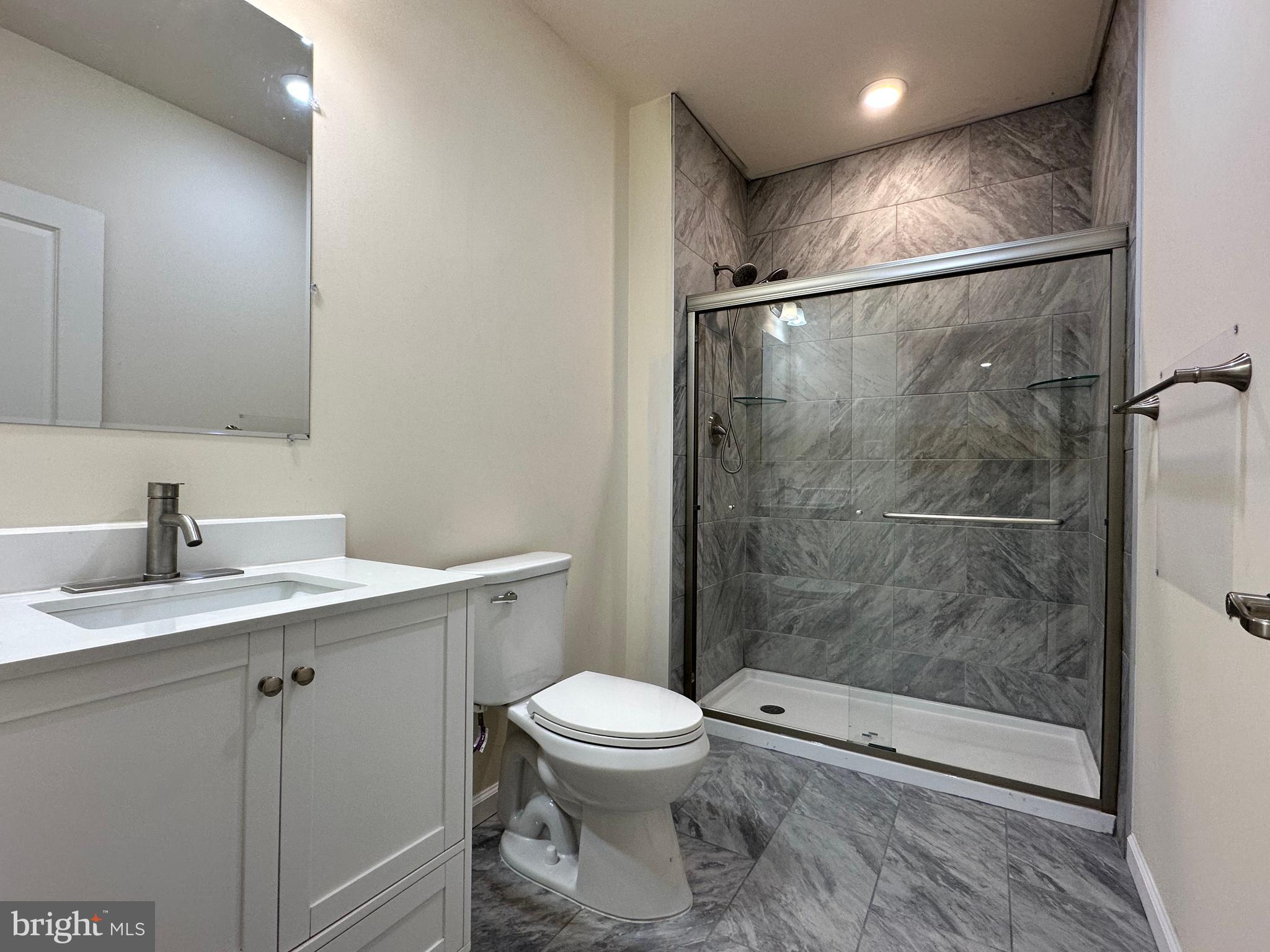 447 Lee Place Exton, PA 19341 - Photo 29 of 31 a bathroom with a toilet sink and shower