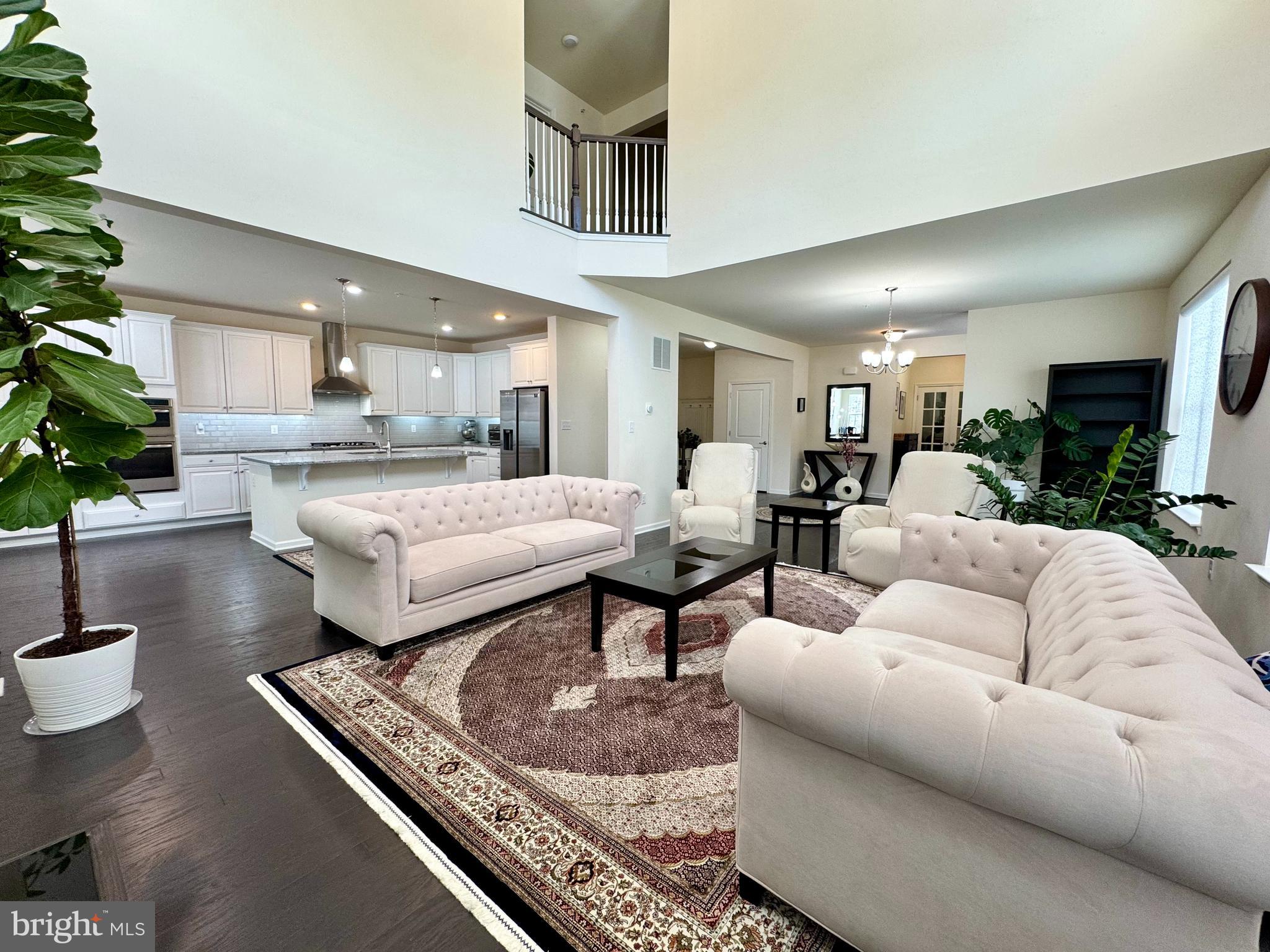 447 Lee Place Exton, PA 19341 - Photo 7 of 31 a living room with furniture and a potted plant