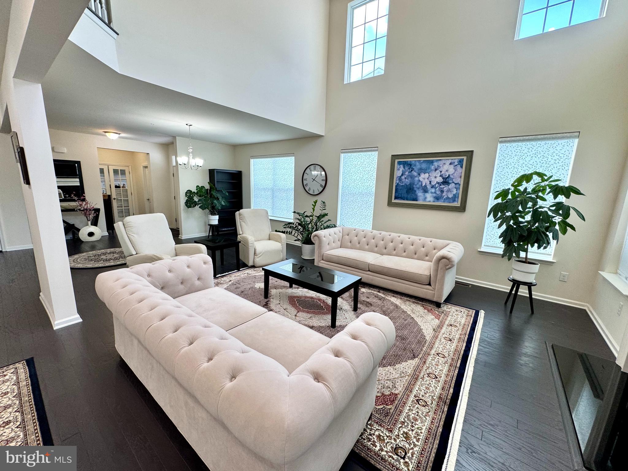 447 Lee Place Exton, PA 19341 - Photo 8 of 31 a living room with furniture and a potted plant