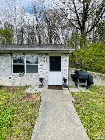 a view of a house with backyard space