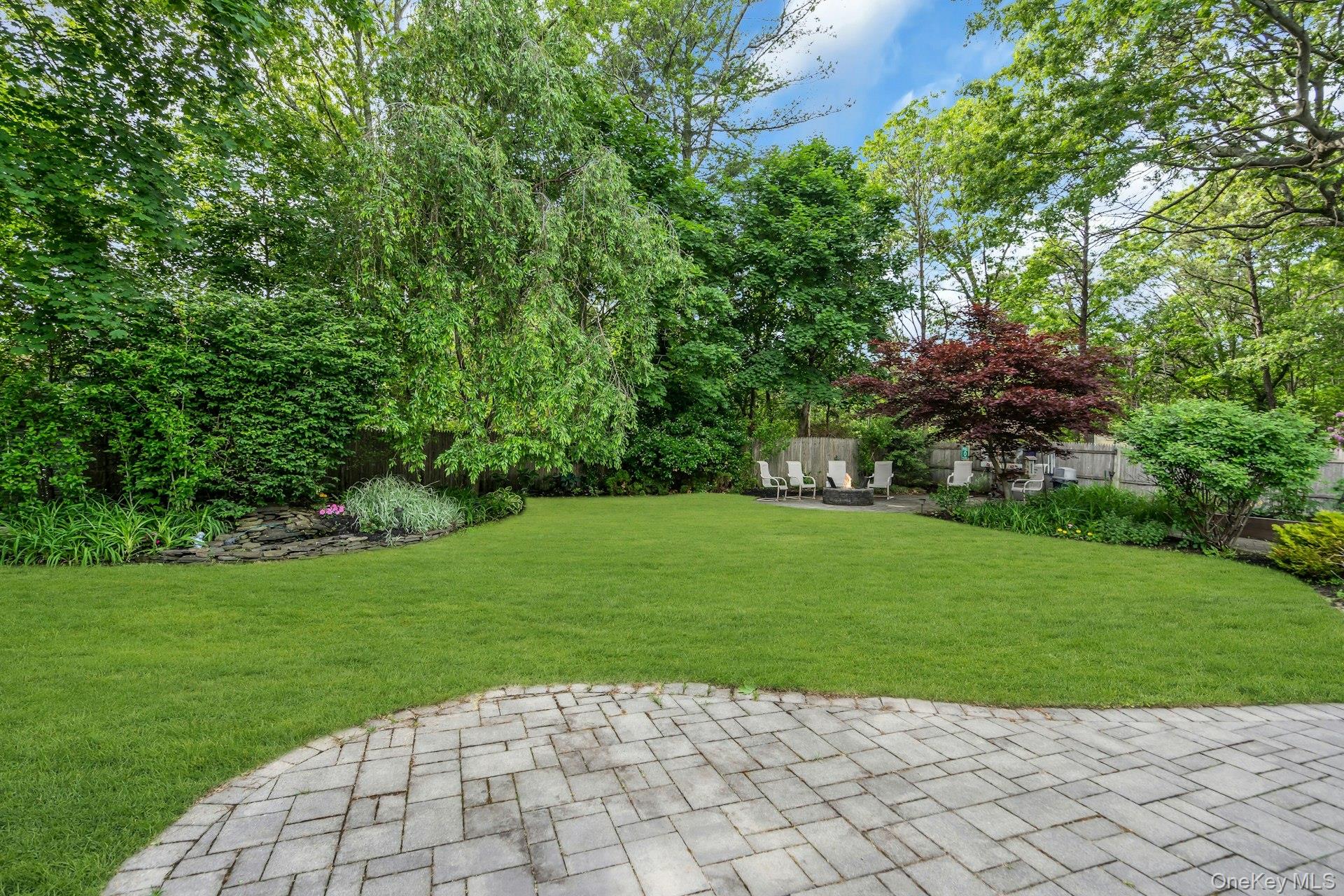 71 Ridge Haven Drive Ridge, NY 11961 - Photo 22 of 23 Fully Fenced Backyard With Water Feature