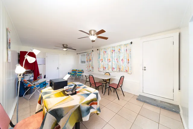 a view of a livingroom with furniture and a window