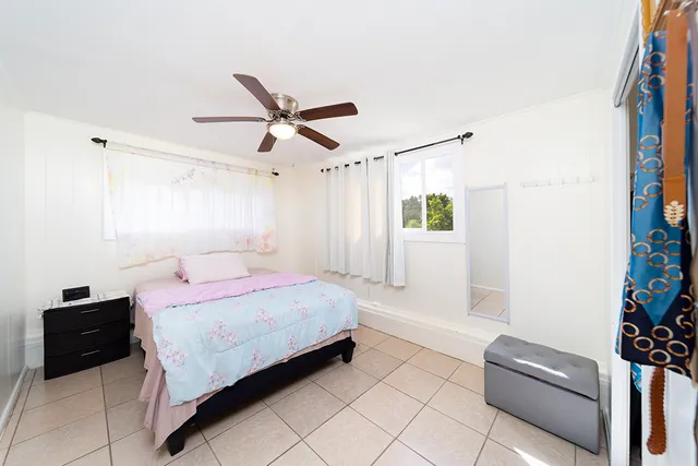 a bedroom with a bed and a couch