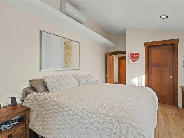 a bedroom with a large bed and a closet