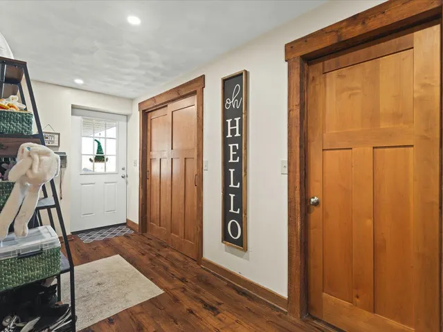 a view of an entryway with wooden floor