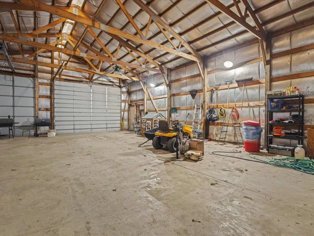 a view of a garage with a bike and wooden roof