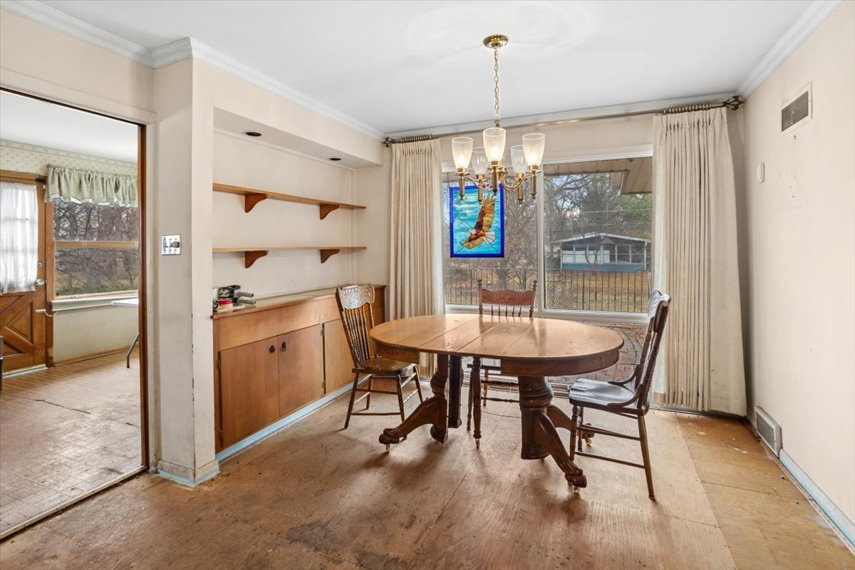 207 Town Acres Lane Roselle, IL 60172 - Photo 11 of 27 a view of a dining room with furniture window and outside view