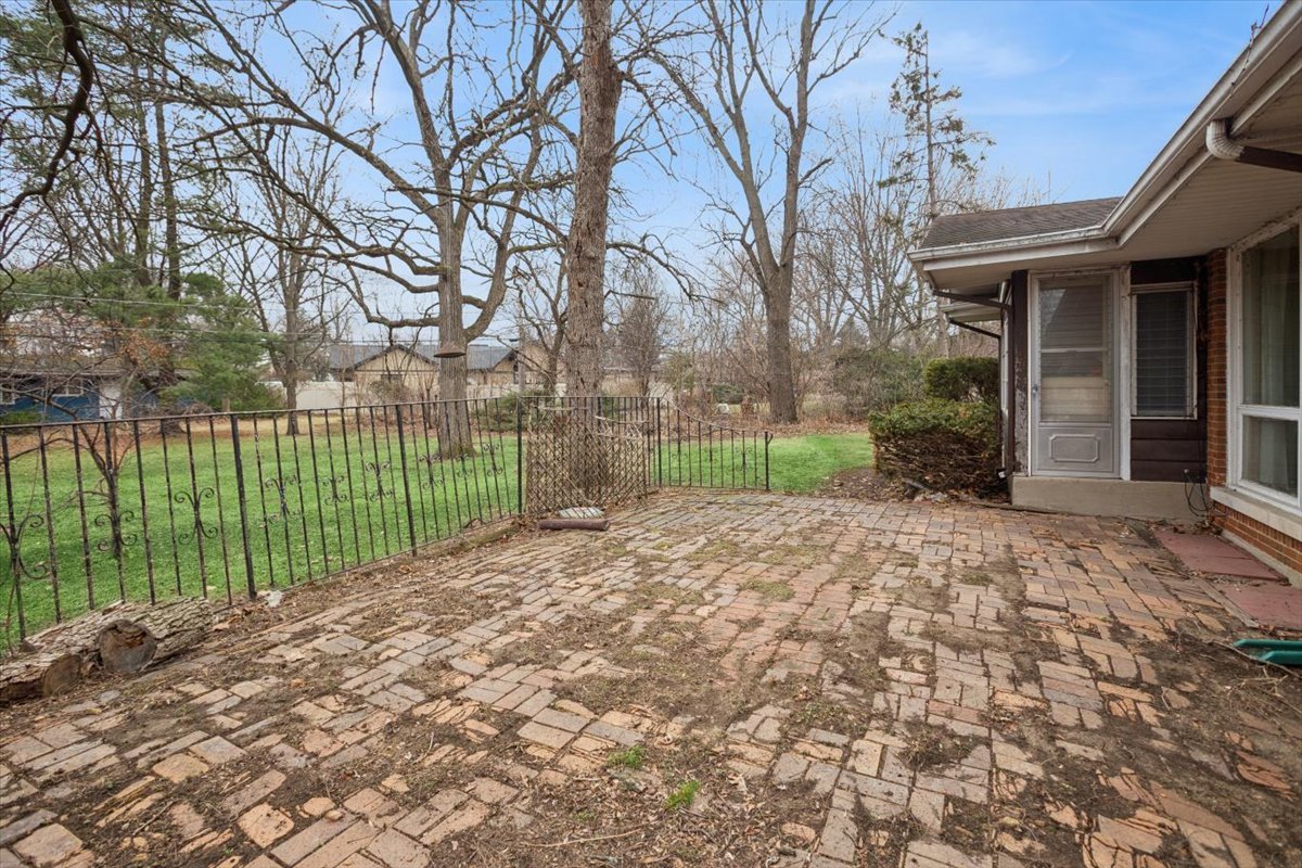 207 Town Acres Lane Roselle, IL 60172 - Photo 22 of 27 a view of a house with a backyard and a garden