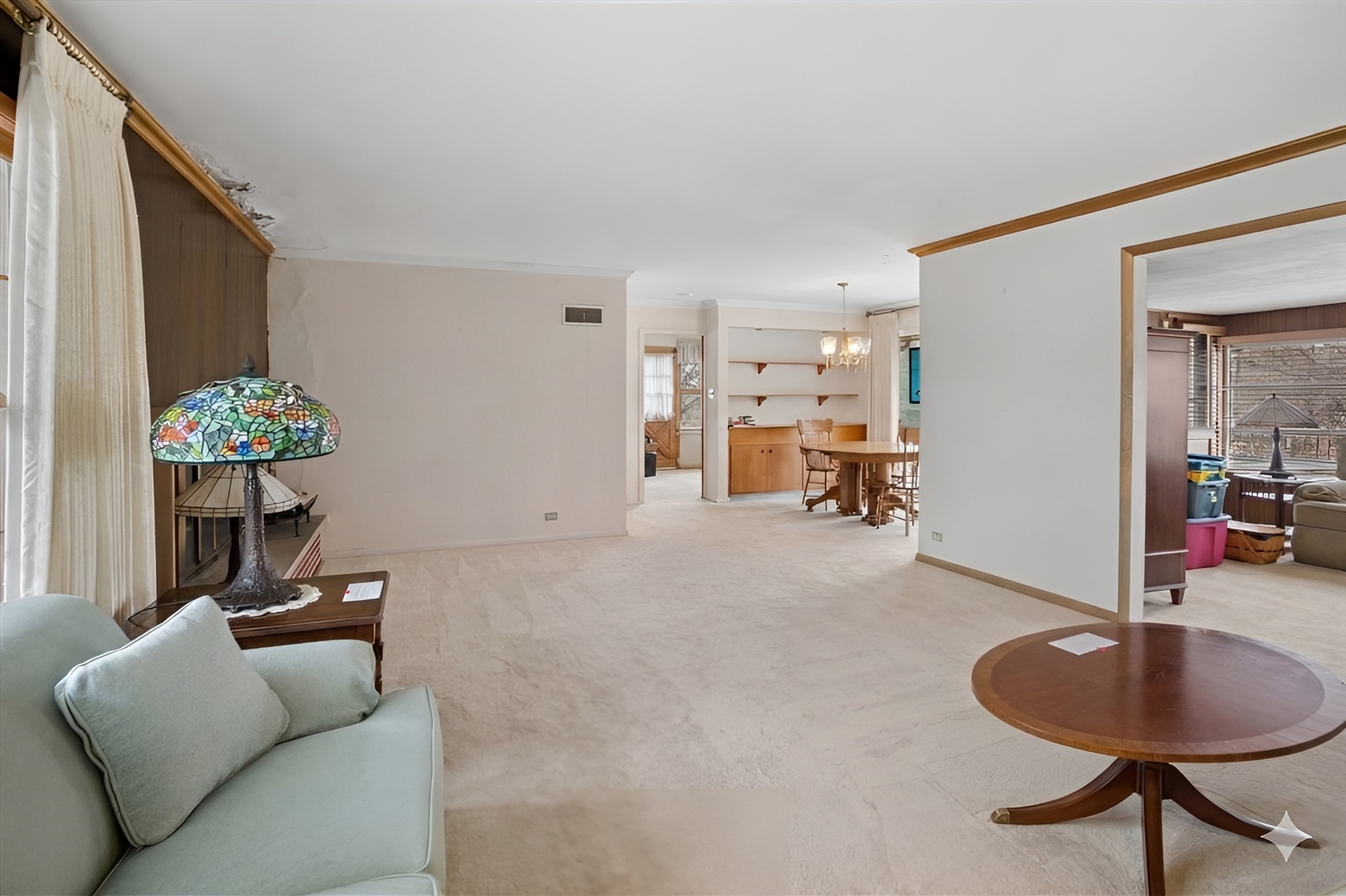 207 Town Acres Lane Roselle, IL 60172 - Photo 3 of 27 a living room with furniture and a chandelier