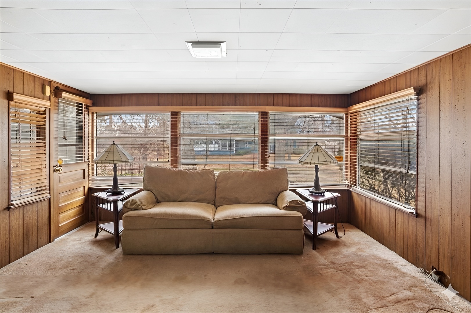 207 Town Acres Lane Roselle, IL 60172 - Photo 7 of 27 a living room with furniture and a floor to ceiling window