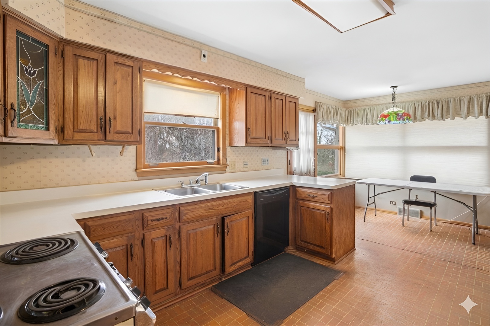 207 Town Acres Lane Roselle, IL 60172 - Photo 8 of 27 a kitchen with kitchen island granite countertop a sink cabinets and window