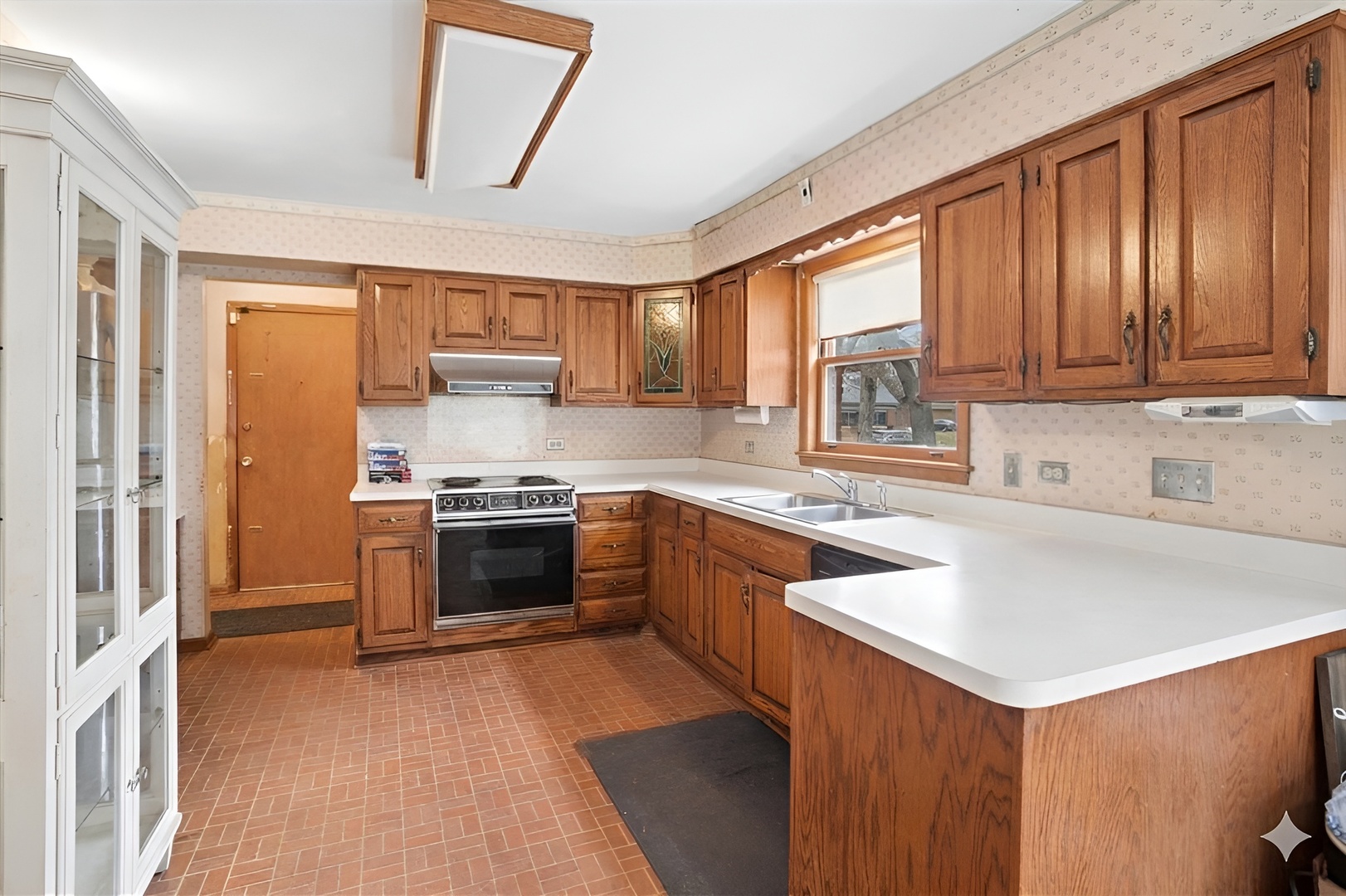 207 Town Acres Lane Roselle, IL 60172 - Photo 9 of 27 a kitchen with a stove a sink and a refrigerator