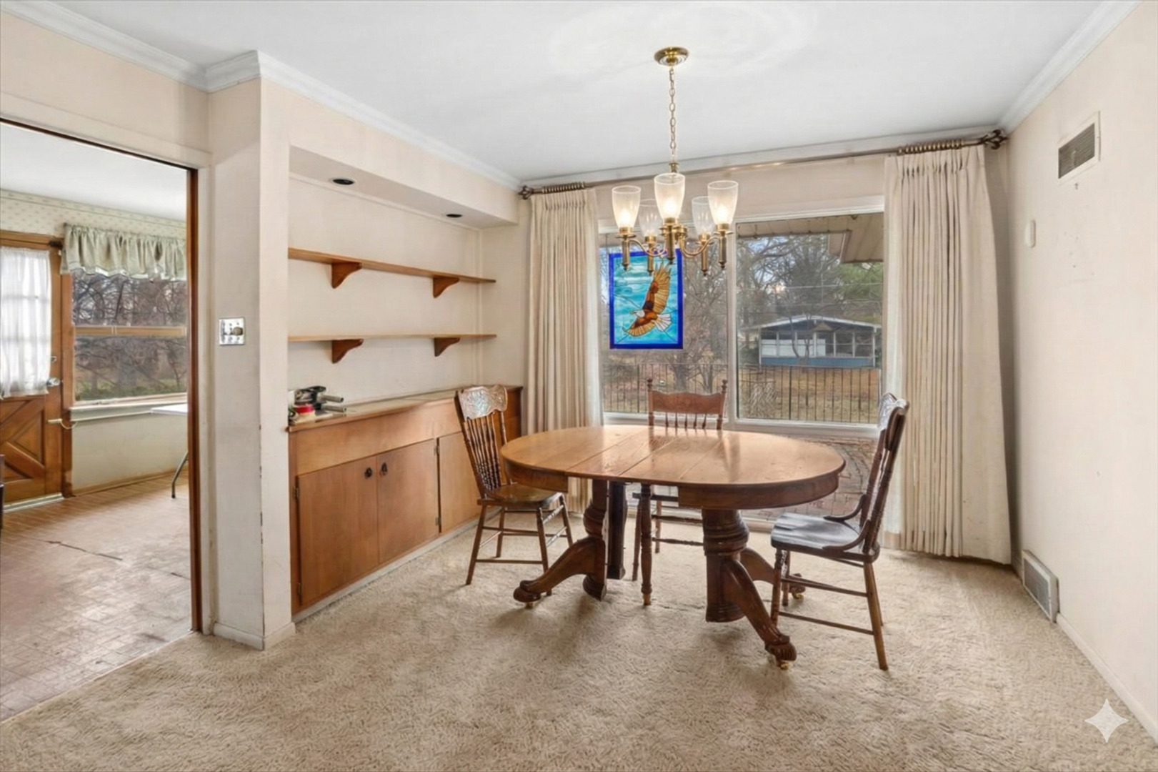 207 Town Acres Lane Roselle, IL 60172 - Photo 10 of 27 a view of a dining room with furniture window and outside view