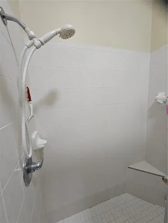 a bathroom with a granite countertop sink and a toilet