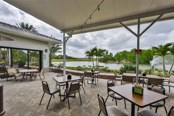 a view of a dining hall with many windows