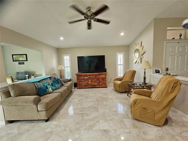 a kitchen with granite countertop stainless steel appliances a refrigerator stove top oven and sink