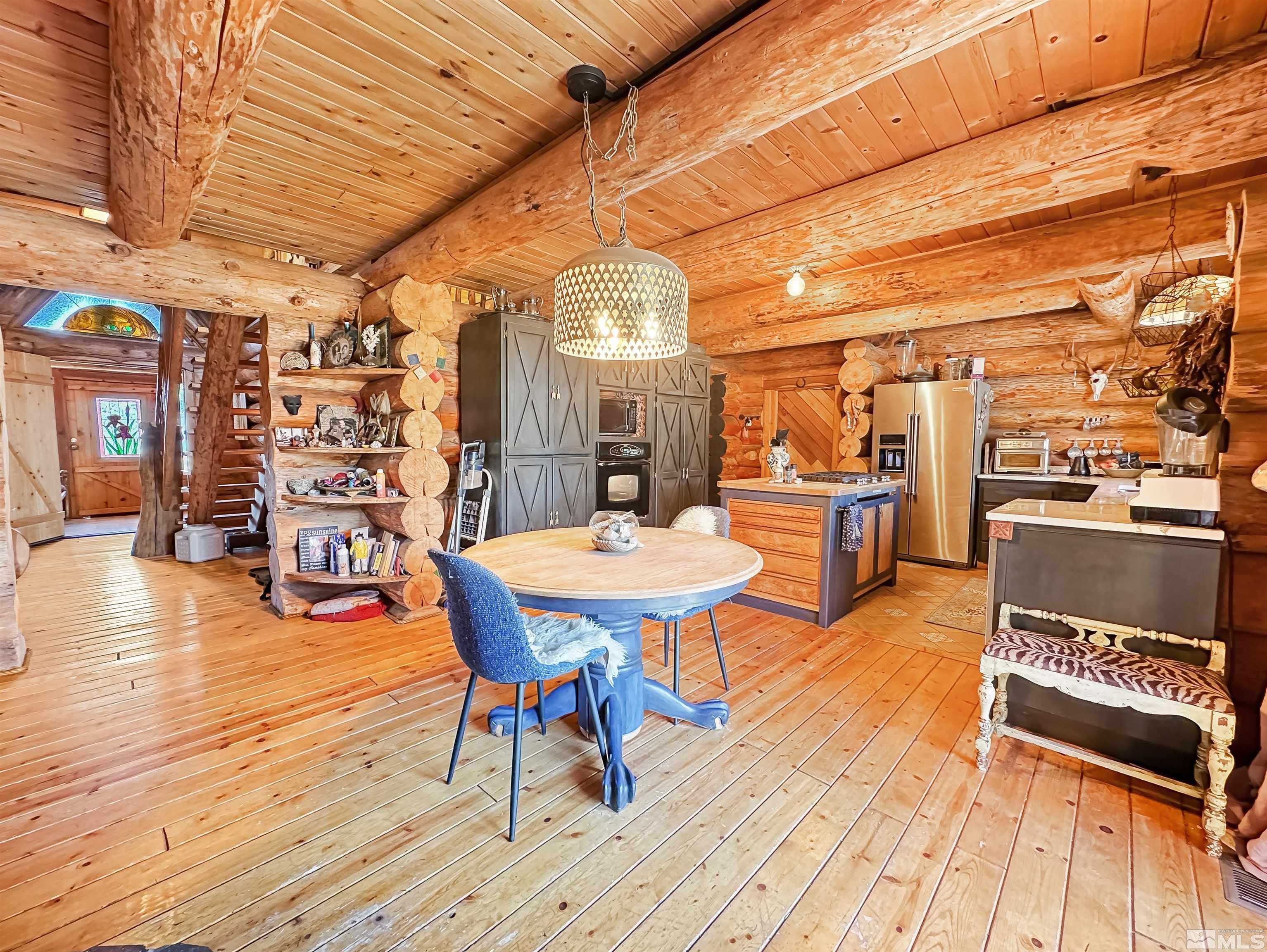 2428 Cartwright Road Reno, NV 89521 - Photo 14 of 39 a dining room with a wooden table and chairs