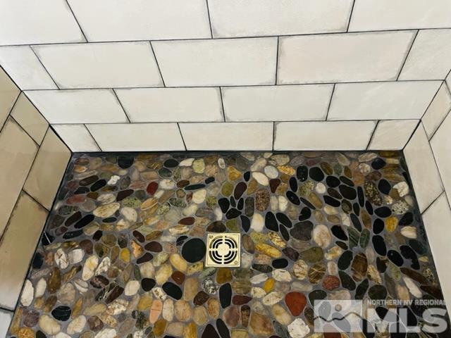 2428 Cartwright Road Reno, NV 89521 - Photo 23 of 39 a bathroom with a shower and a tiled wall