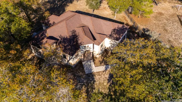 a view of a house with a tree