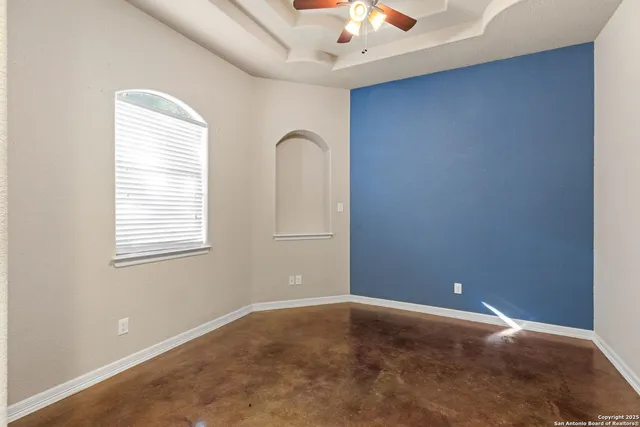 a kitchen with granite countertop a stove and a refrigerator
