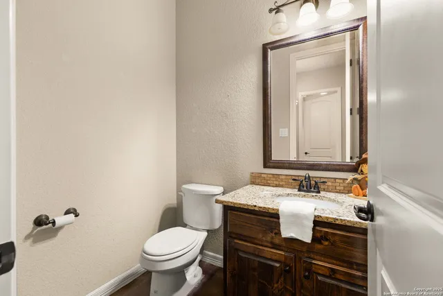 a view of a pathway gate with wooden fence
