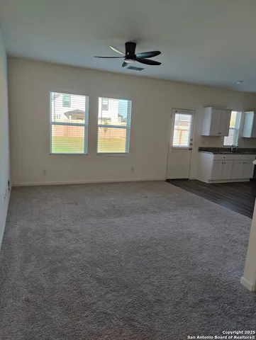 a view of empty room with windows