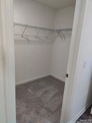a view of an empty walk in closet