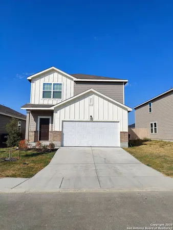 a front view of a house with garage