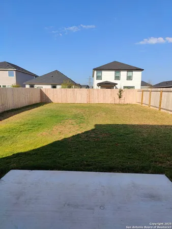 a view of a backyard with a garden and plants