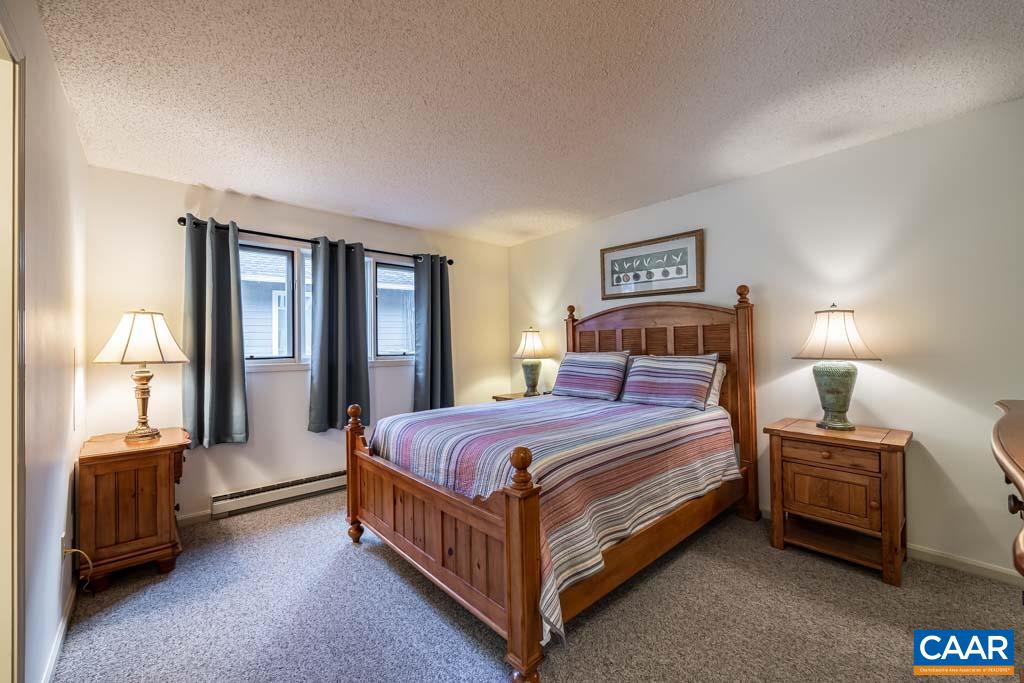 2071 Stone Ridge Wintergreen, VA 22967 - Photo 17 of 25 a bedroom with a bed and a lamp