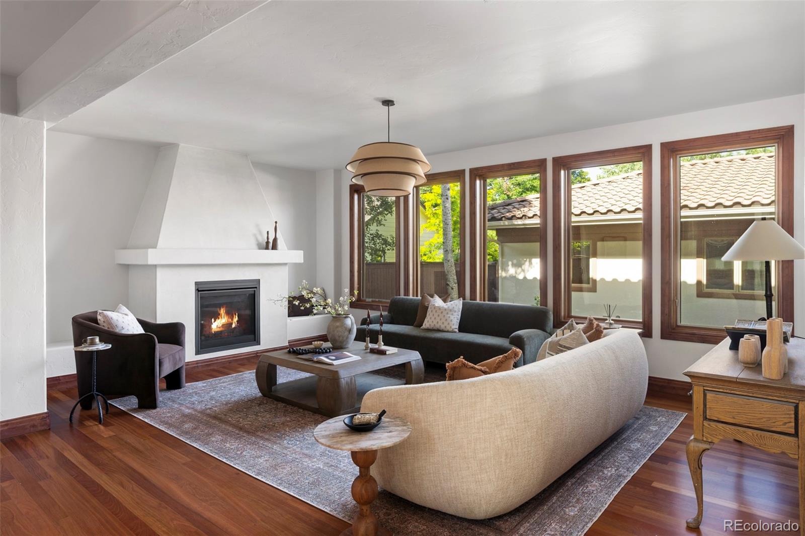 1026 South Cook Street Denver, CO 80209 - Photo 11 of 34 a living room with furniture fireplace and a large window