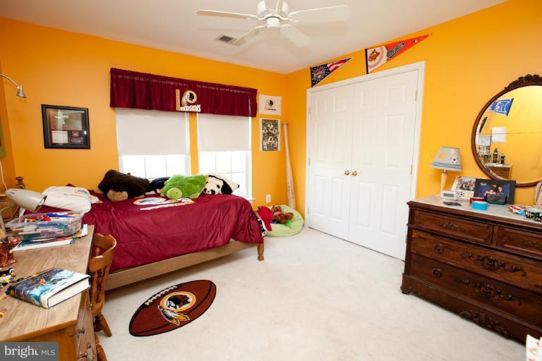 14410 Autumn Crest Road Boyds, MD 20841 - Photo 16 of 25 a bed room with a bed and a chair