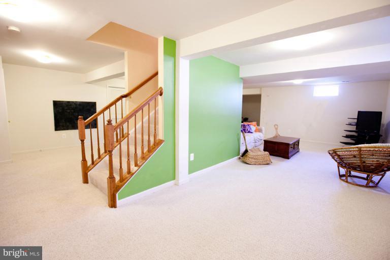14410 Autumn Crest Road Boyds, MD 20841 - Photo 17 of 25 a bedroom with furniture and a flat screen tv