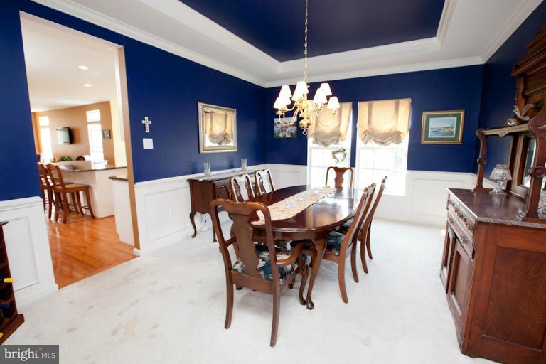 14410 Autumn Crest Road Boyds, MD 20841 - Photo 22 of 25 a view of a dining room with furniture window and wooden floor