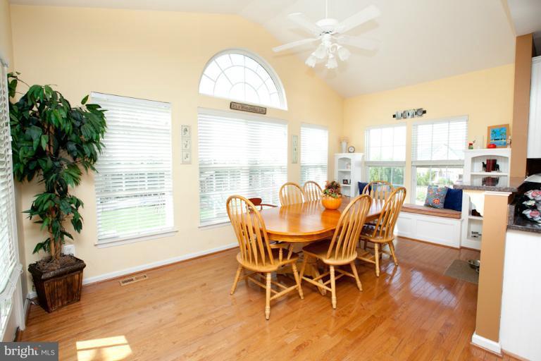 14410 Autumn Crest Road Boyds, MD 20841 - Photo 24 of 25 a view of a dining room with furniture window and wooden floor