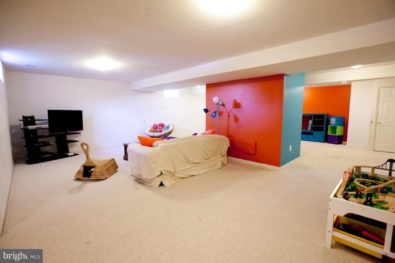 14410 Autumn Crest Road Boyds, MD 20841 - Photo 6 of 25 a bedroom with furniture and a flat screen tv