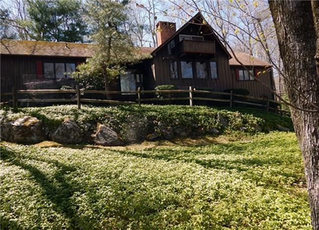 30 Nod W Drive Ridgefield, CT 06877 - Photo 1 of 1 a front view of a house with a yard