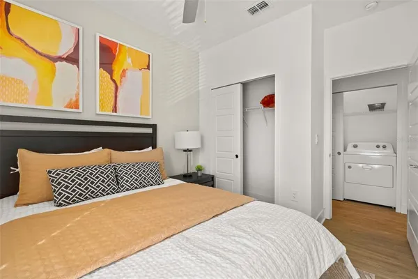 a bedroom with a bed and a window