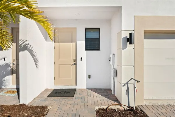 a view of walk in closet with rug and wooden floor