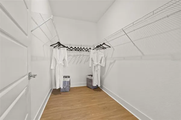 a view of a bathroom with a shower and a tub