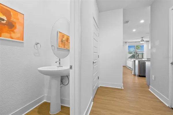 a view of a kitchen from the hallway