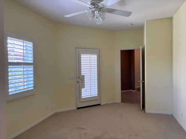 a kitchen with a refrigerator sink and cabinets