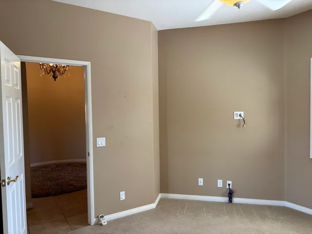 a kitchen with cabinets stainless steel appliances and a window