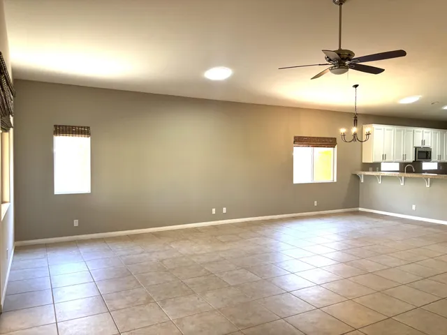 a lobby with a couch and floor to ceiling window