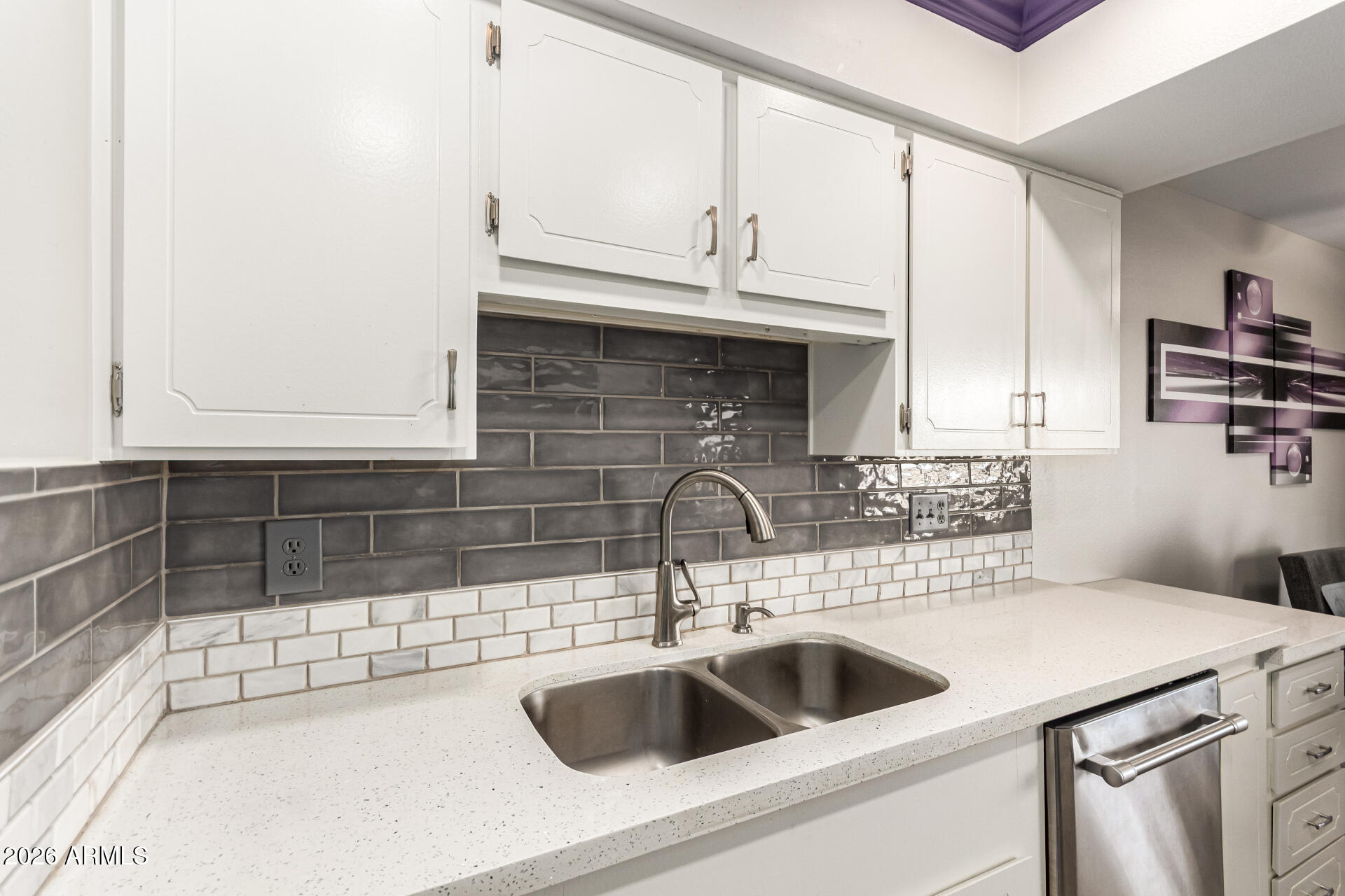 19618 North Star Ridge Drive Sun City West, AZ 85375 - Photo 14 of 37 a kitchen with a sink and cabinets