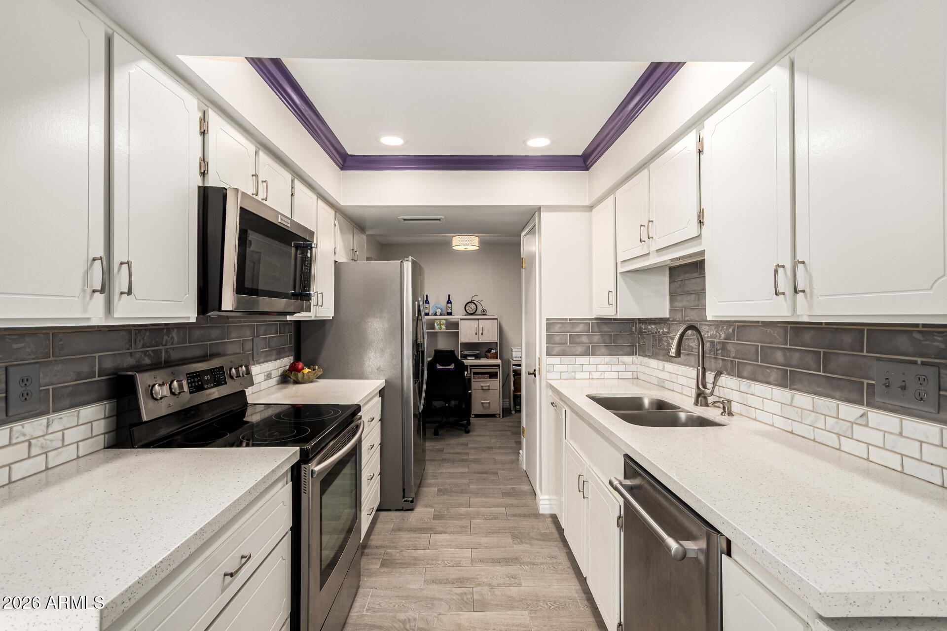 19618 North Star Ridge Drive Sun City West, AZ 85375 - Photo 16 of 37 a kitchen with a sink stove top oven and cabinets