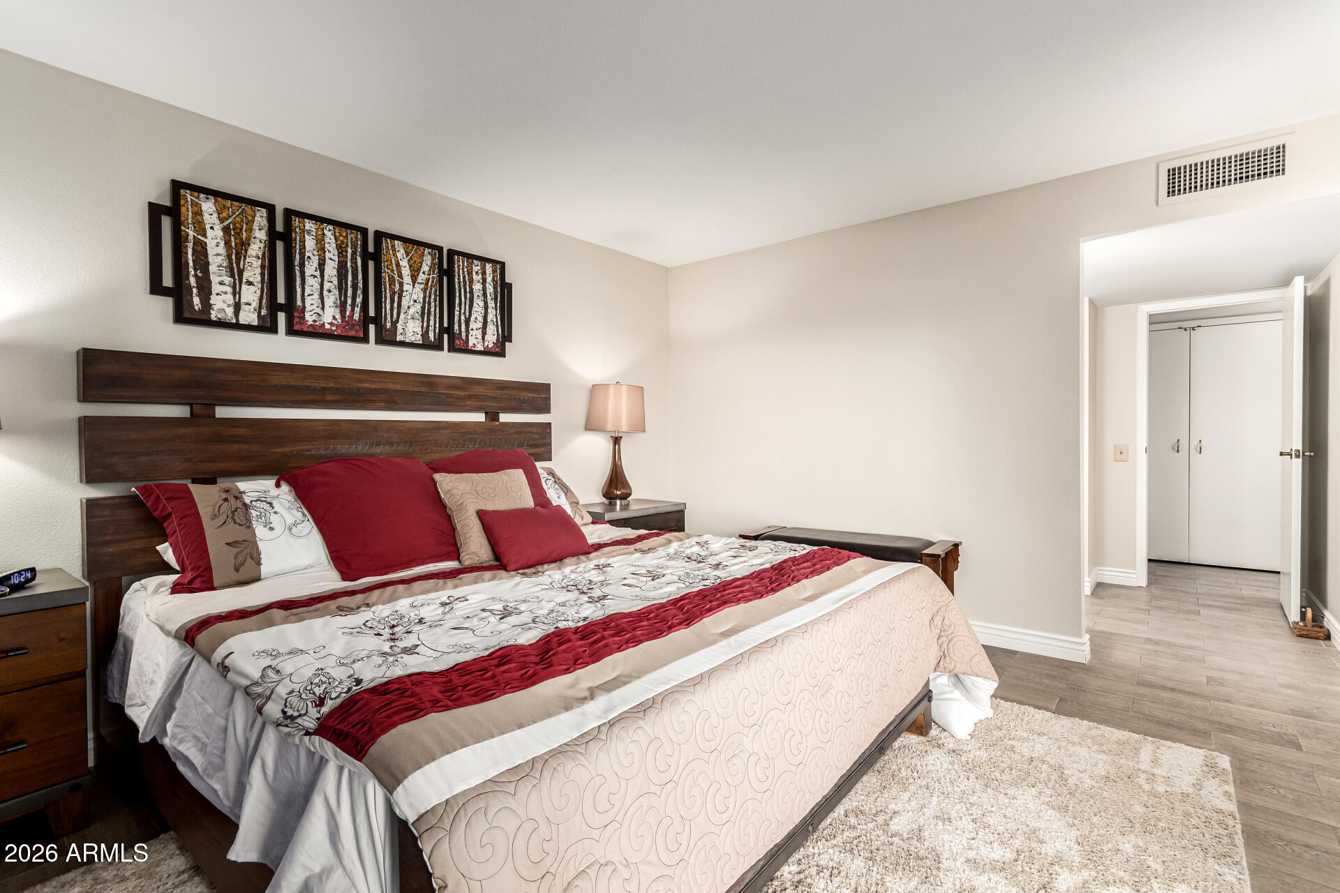 19618 North Star Ridge Drive Sun City West, AZ 85375 - Photo 19 of 37 a bedroom with a bed and a book shelf